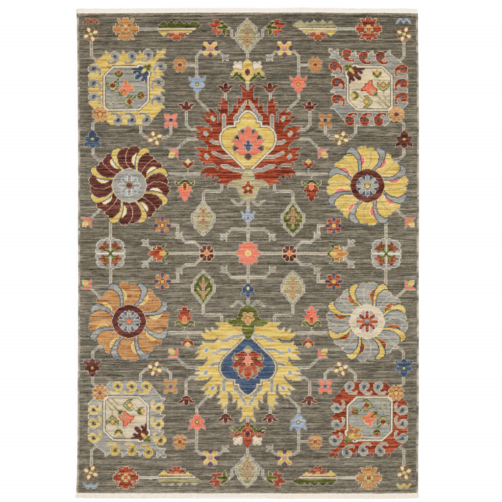 10' X 13' Grey Charcoal Yellow Blue Rust Red Pink Green And Ivory Oriental Power Loom Stain Resistant Area Rug With Fringe
