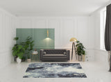 7' X 10' Blue and Ivory Abstract Power Loom Area Rug