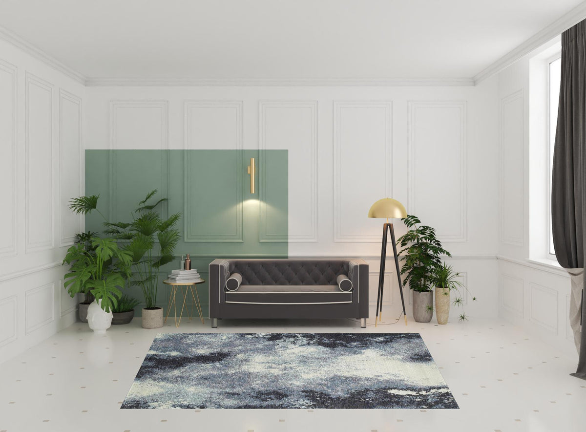 7' X 10' Blue and Ivory Abstract Power Loom Area Rug