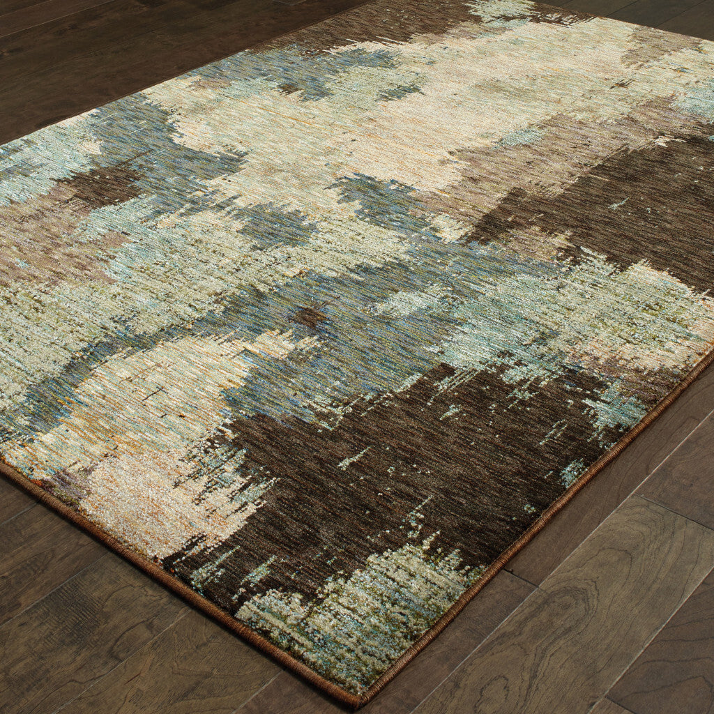 8' X 11' Blue and Ivory Abstract Power Loom Area Rug