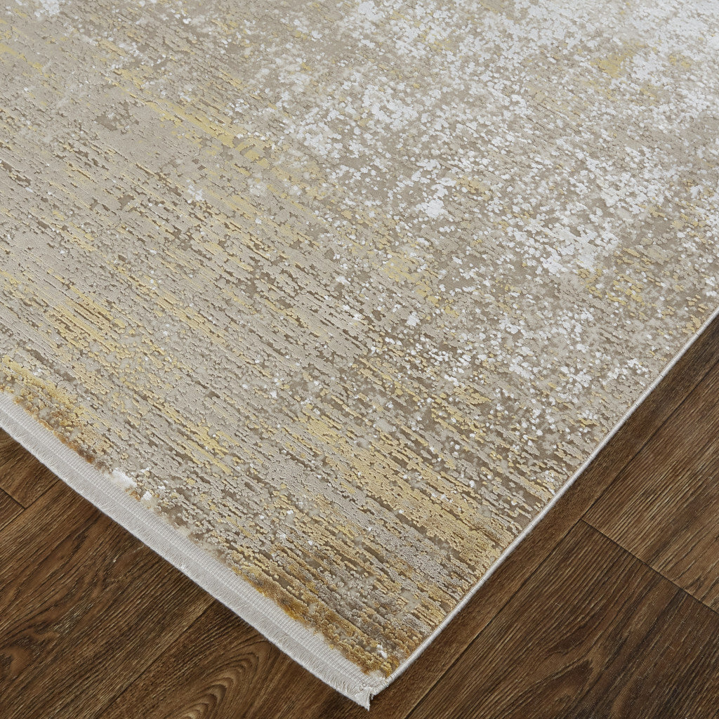 7' X 10' Gold and Ivory Abstract Area Rug With Fringe