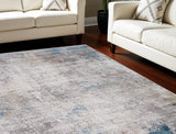 13' X 20' Ivory Gray and Blue Abstract Power Loom Area Rug With Fringe