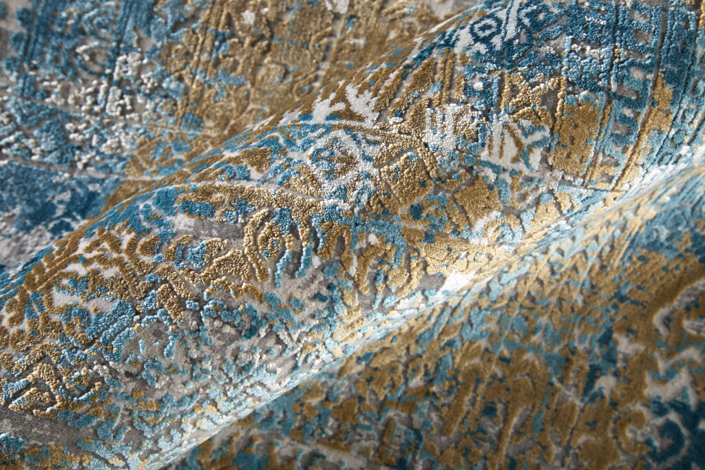 13' X 20' Blue Gold and Gray Abstract Power Loom Area Rug With Fringe