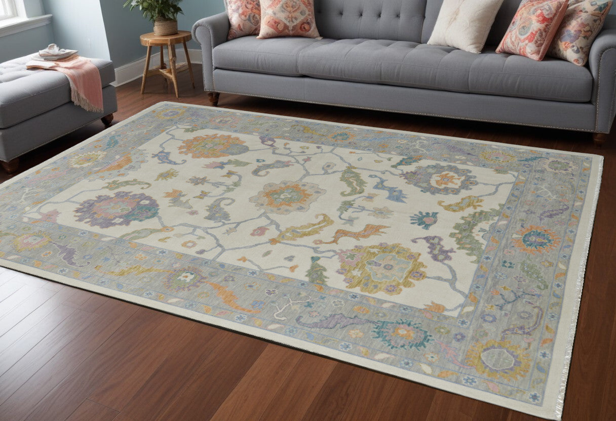 6' X 9' Gray Ivory and Orange Wool Floral Hand Knotted Area Rug With Fringe