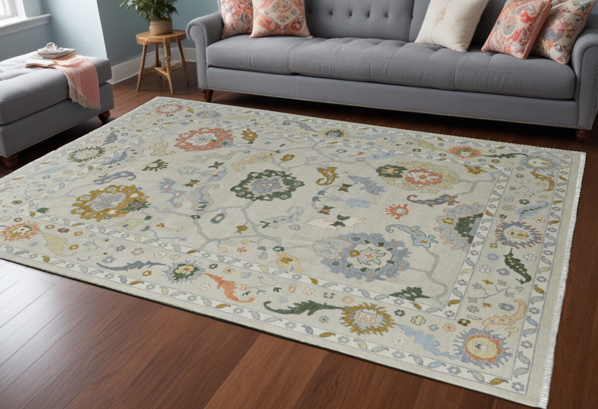 6' X 9' Gray Ivory and Gold Wool Floral Hand Knotted Area Rug With Fringe