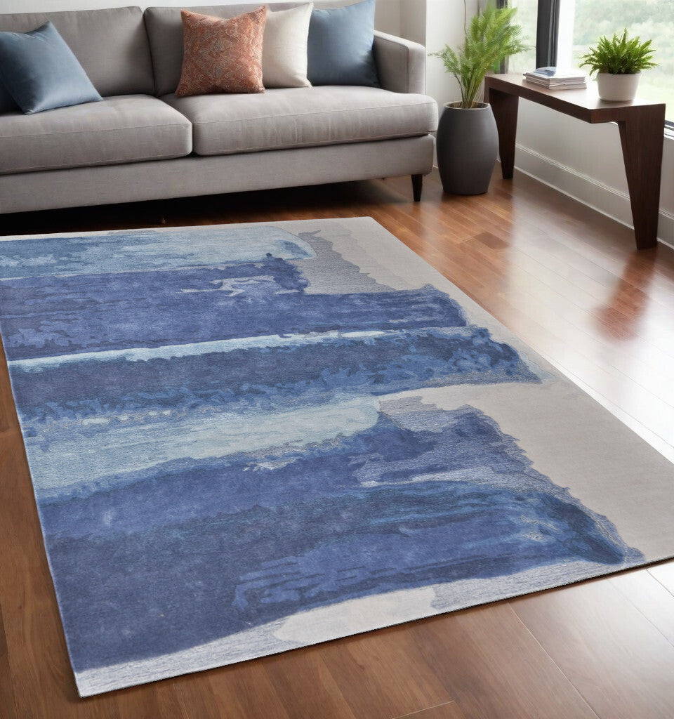 5' X 8' Blue and Ivory Abstract Hand Tufted Area Rug