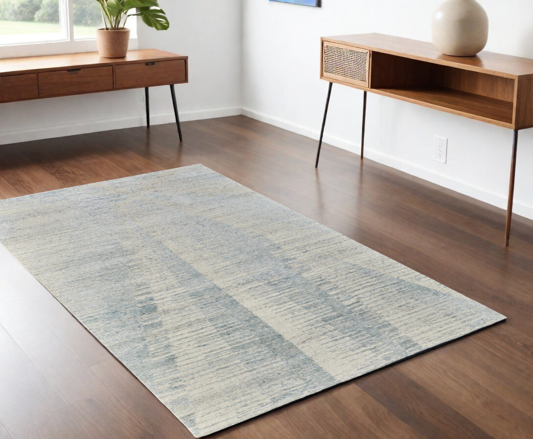4' X 6' Ivory and Blue Abstract Hand Knotted Worn Faded Area Rug