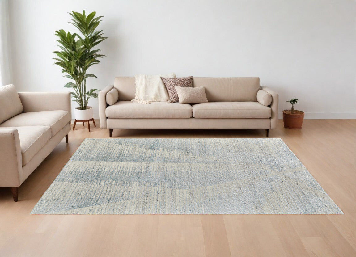 9' X 13' Ivory and Blue Abstract Hand Knotted Worn Faded Area Rug