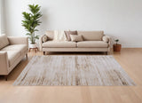 9' X 13' Ivory and Tan Abstract Power Loom Worn Faded Area Rug