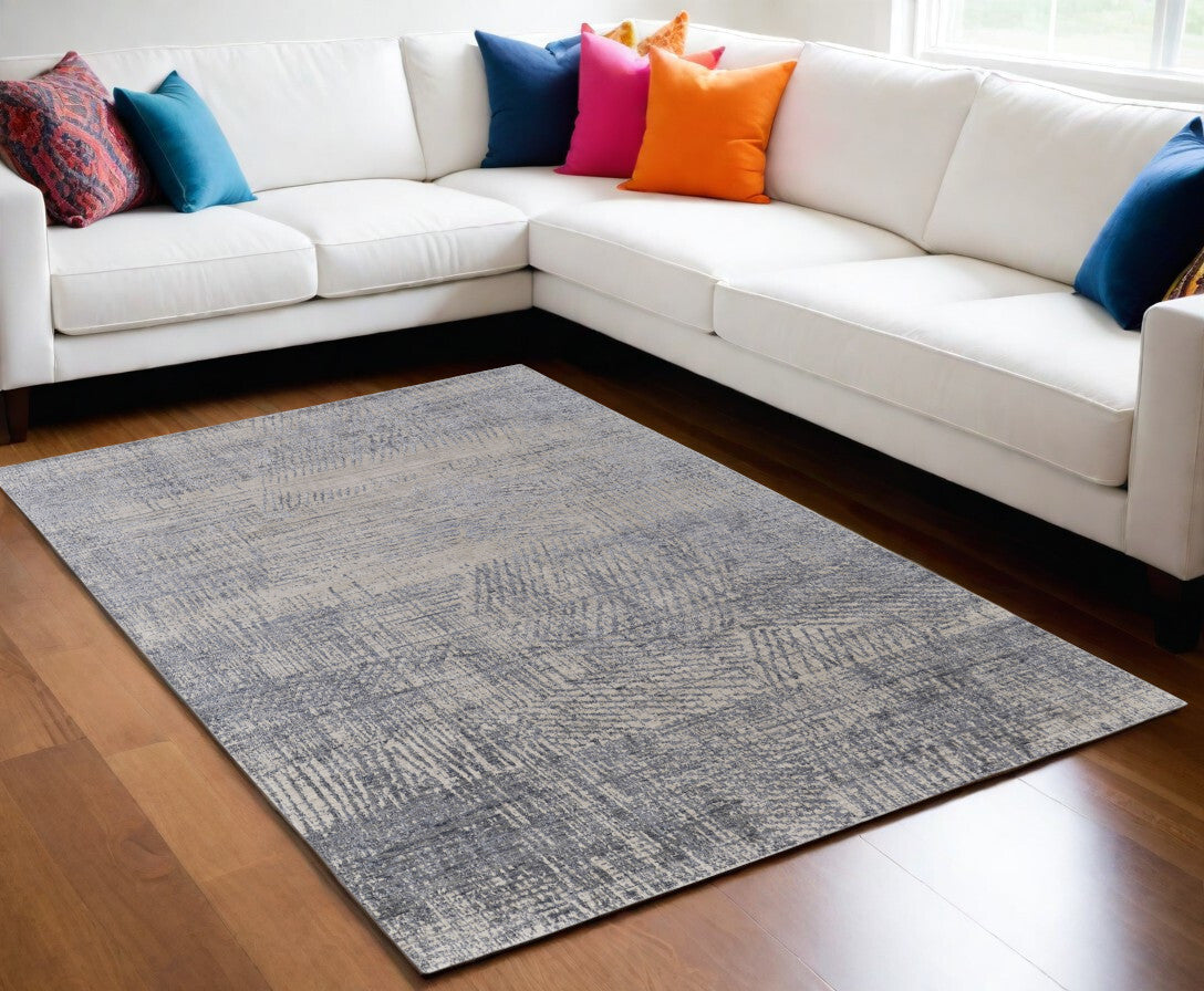 5' X 8' Gray Ivory and Blue Abstract Hand Woven Worn Faded Area Rug