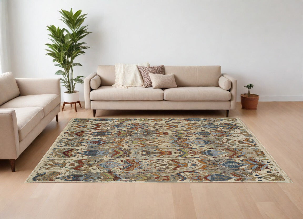 12' X 15' Ivory Blue and Brown Wool Ikat Hand Knotted Area Rug With Fringe