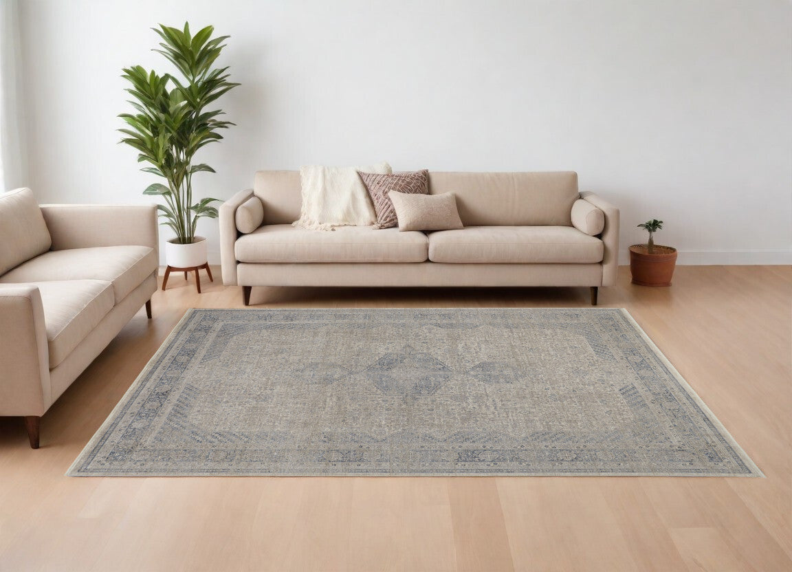 7' X 10' Gray Blue and Taupe Oriental Power Loom Worn Faded Area Rug With Fringe