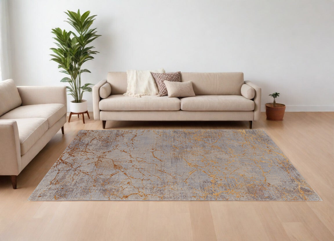 7' X 10' Brown Gold and Gray Abstract Power Loom Area Rug