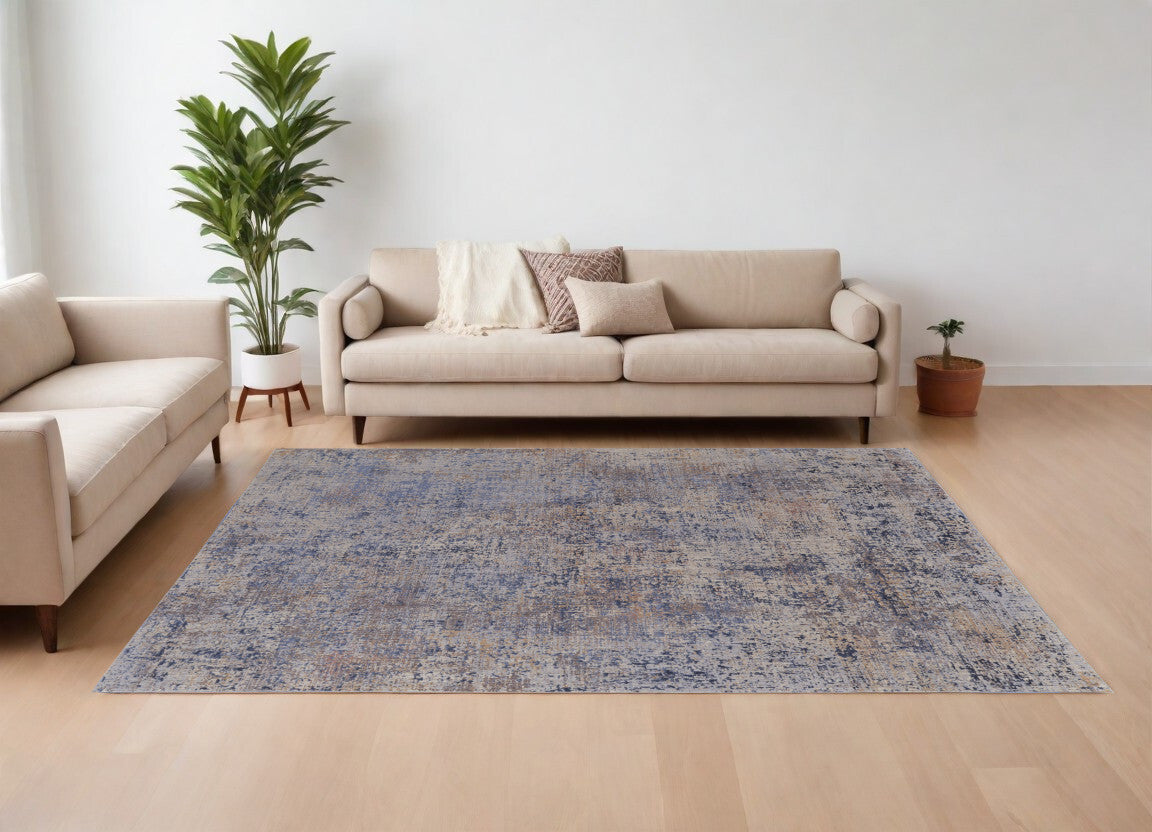 7' X 10' Blue Brown and Tan Abstract Power Loom Area Rug
