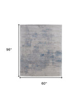 5' X 8' Gray Taupe and Blue Abstract Hand Tufted Area Rug